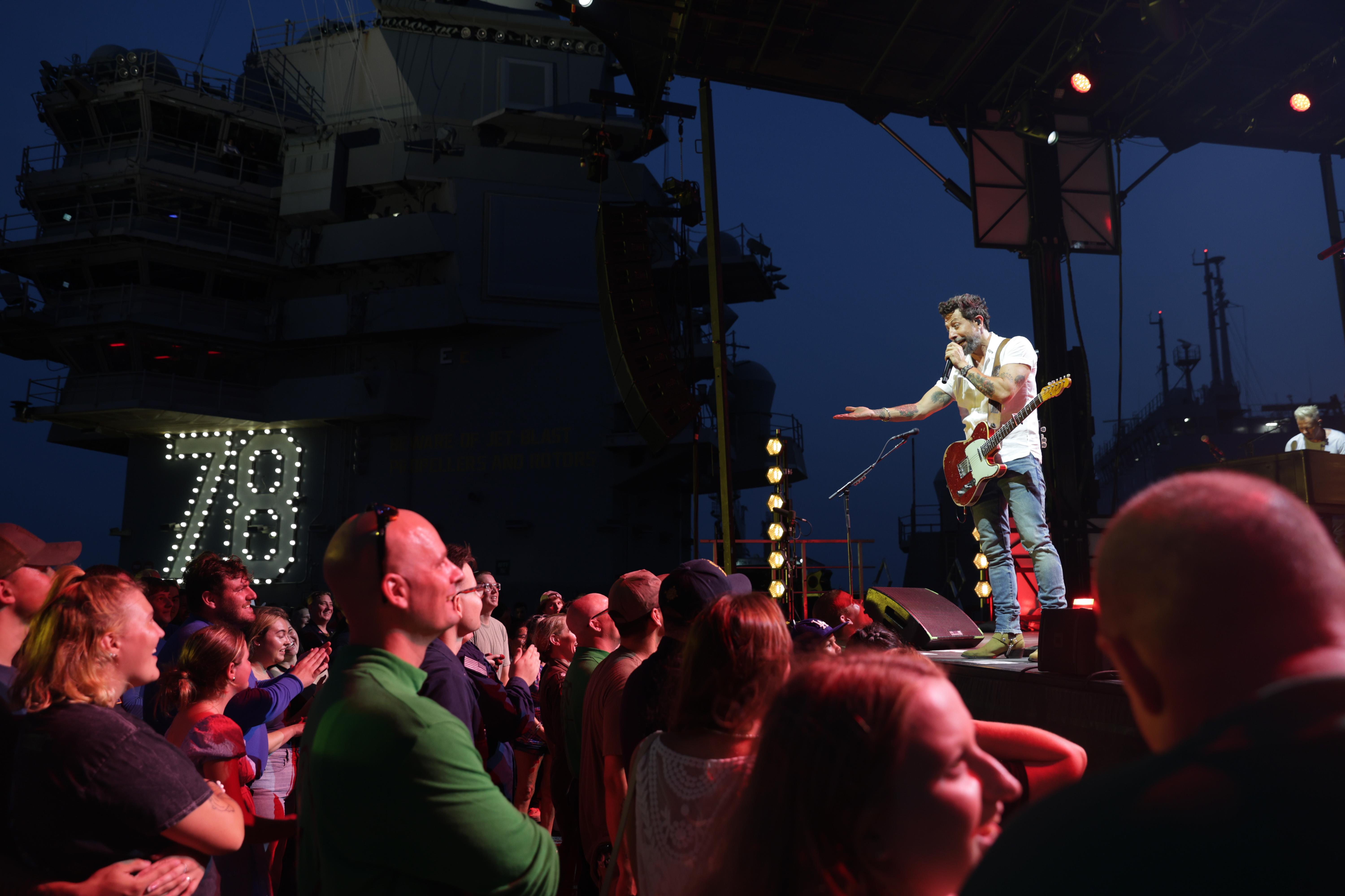 Sailors assigned to the world’s largest aircraft carrier, USS Gerald R. Ford (CVN 78) and their families, attend a performance by country band Old Dominion, on the flight deck presented by Navy Morale Welfare and Recreation Entertainment, July, 30, 2024. Ford is currently pier side at Naval Station Norfolk conducting routine maintenance. (U.S. Navy photo by Mass Communication Specialist 2nd Class Jacob Mattingly)